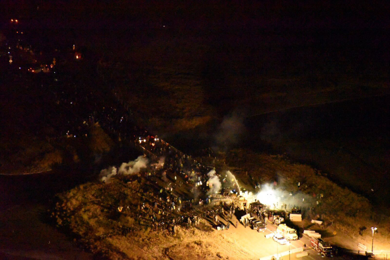 Morton County Sheriff’s Department and pipeline opponents clash in Cannon Ball, North Dakota, November 20, 2016, the night Sophia Wilansky was injured. Photo: AP